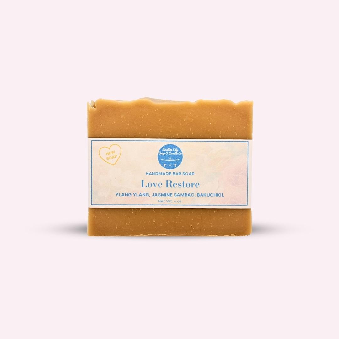 Handcrafted Love Restore soap bar by Boulder City Soap & Candle, infused with Ylang Ylang, Jasmine Sambac, and Bakuchiol for restoring mature skin.